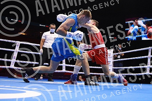 2021 Olympic Boxing World Championships - Stark Arena. Round 32, Light Welterweight (63.5kg), Mateo Komadina (Croatia) (RED) vs Denys Pesotskyy (Ukraine).Svetsko prvenstvo u olimpijskom boksu 2021 - Stark arena.