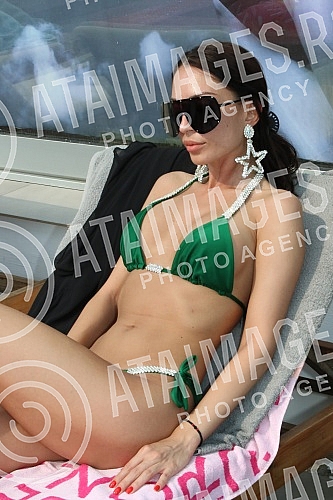 Singer Anastasija Budjic with husband Ivan Radovic - Koki at swimming pool.Pevacica Anastasija Budjic sa muzem Ivanom Radovicem - Koki na bazenu.