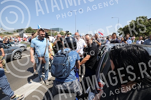Workers of Kragujevac's Fiat blocked the highway near the Sava Center in Belgrade, as they announced because even after several rounds of negotiations they did not reach a solution with the Government of Serbia and the company on guarantees that ther