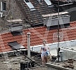 Belgrade residents on the terraces and rooftops of buildings during the curfew, which began at 6 p.m., ending Monday at 5 p.m.Stanovnici Beograda na terasama i krovovima zgrada tokom policijskog casa koji je poceo u peak u 18.00 casova, a zavrsava s