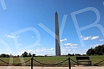 The Washington Monument, a monument to George Washington, the first President of the United States, is one of the most prominent landmarks in Washington and stands as a central part of the National Mall, and is surrounded by American flags. Vasingt