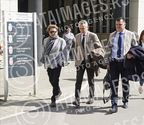 Dragan Bjelorglic and his lawyers are leaving the First Basic Court in Belgrade, where the trial for the criminal act of violent behavior began today. Dragan Bjelorglic i advokati izlaze iz Prvog osnovnog suda u Beogradu gde je danas pocela sudjenj