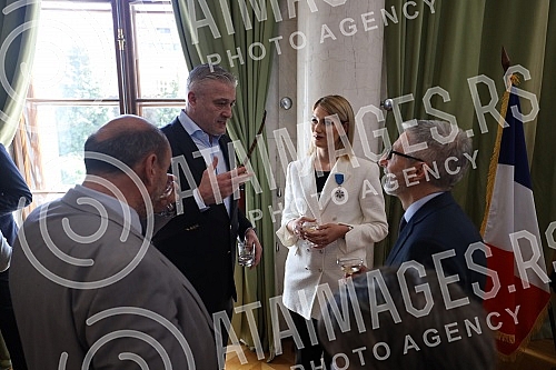 French Ambassador Pierre Cochard presented the National Order of Merit to basketball player Natasa Kovacevic StojakovicAmbasador Francuske Pjer Kosar urucio je Nacionalni orden za zasluge kosarkasici Natasi Kovacevic Stojakovic.
