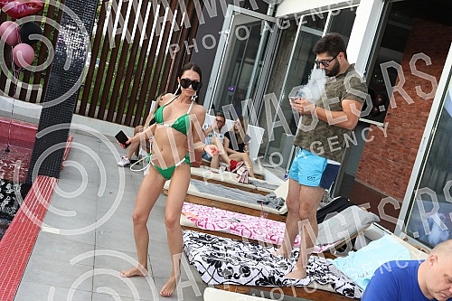 Singer Anastasija Budjic with husband Ivan Radovic - Koki at swimming pool.Pevacica Anastasija Budjic sa muzem Ivanom Radovicem - Koki na bazenu.