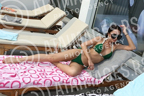 Singer Anastasija Budjic with husband Ivan Radovic - Koki at swimming pool.Pevacica Anastasija Budjic sa muzem Ivanom Radovicem - Koki na bazenu.