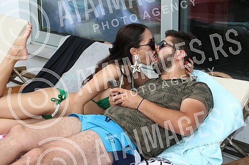 Singer Anastasija Budjic with husband Ivan Radovic - Koki at swimming pool.Pevacica Anastasija Budjic sa muzem Ivanom Radovicem - Koki na bazenu.