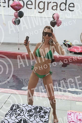 Singer Anastasija Budjic with husband Ivan Radovic - Koki at swimming pool.Pevacica Anastasija Budjic sa muzem Ivanom Radovicem - Koki na bazenu.