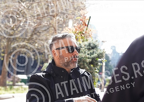 Director Srdan Golubovic is sitting in the garden of a cafe on Nikola Pasic Square.Reditelj Srdan Golubovic sedi u basti kafica na Trgu Nikole Pasica.