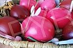 The red color is a symbol of joy and resurrection, and the first red egg is kept until the next Easter as a 