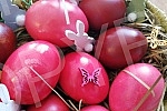 The red color is a symbol of joy and resurrection, and the first red egg is kept until the next Easter as a 