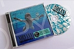 Cover and CD Nevermind, the second studio album of the American music group Nirvana, released on September 24, 1991 by Geffen Records.Omot i CD-a Nevermind, drugog studijskog albuma americke muzicke grupe Nirvana, objavljenog 24. septembra 1991. u