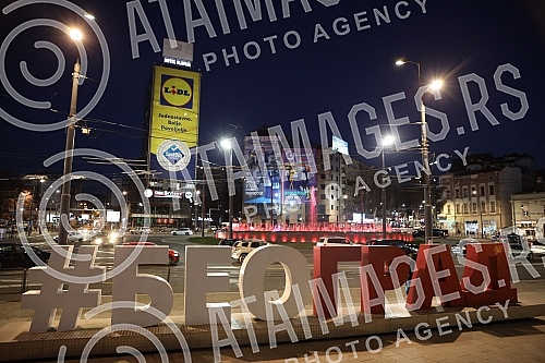 Roundabout on Slavija Square with illuminated fountain at night.Kruzni tok na Trgu Slavija  sa osvetljenom fontanom nocu.