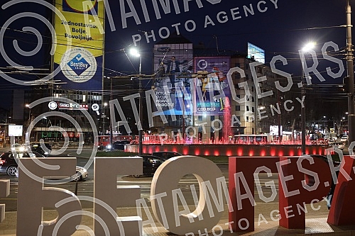 Roundabout on Slavija Square with illuminated fountain at night.Kruzni tok na Trgu Slavija  sa osvetljenom fontanom nocu.