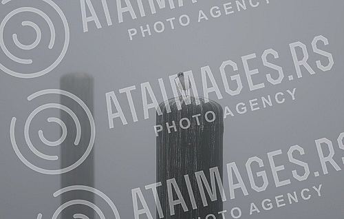 City pollution mixed with morning fog, Belgrade cityscape.Zagadjenje grada pomesano sa jutarnjom maglom, gradski pejzaz Beograda.