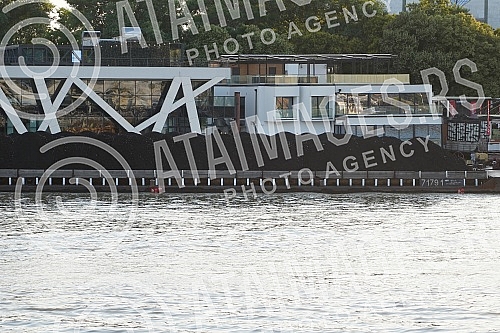 The coal on the barge floats on the Sava River in the direction of Obrenovac.Ugalj na barzi plovi rekom Savom u pravcu  Obrenovca.