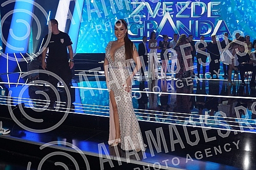 The finals of the 15th season of the Zvezda Granda music competition are being held in the Grand Studio, and 16 candidates are fighting for the award.Finale 15. sezone muzickog takmicenja Zvezde Granda odrzava se u Grand studiju,  a za nagradu se b