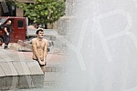 A migrant from Kuwait is bathing in a fountain on Nikola Pasic Square.Migrant iz Kuvajta se kupa u fontani na Trgu Nikole Pasica.